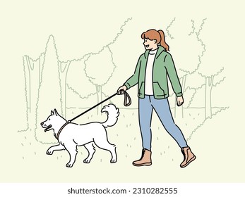 Smiling woman walking with dog on leash in park. Happy girl enjoy walk with puppy in nature. Pet ownership concept. Vector illustration. 