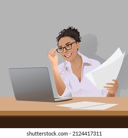 Smiling working women on a laptop
