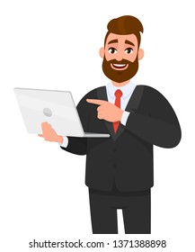 Smiling young bearded business man holding/showing latest brand new laptop computer device and pointing it with hand finger. Modern lifestyle, digital technology trend, portable gadget  in cartoon.