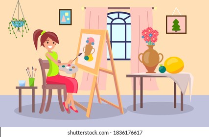 Smiling young girl drawing the picture holding paint brush sitting on the chair in home interior. Woman artist with a painting. Painter female character engaged favorite hobby in room or studio