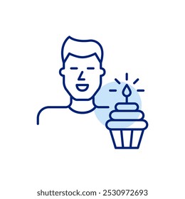 Smiling young man avatar and cupcake with lit candle. Birthday party, user milestone celebration. Pixel perfect, editable stroke icon