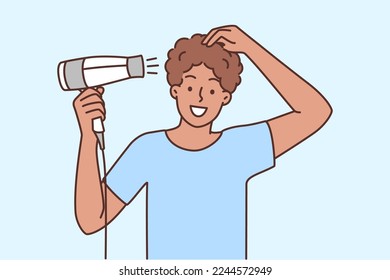 Smiling young man blowing hair with hairdryer. Happy guy take care of hairstyle with dryer. Beauty and wellbeing. Vector illustration. 