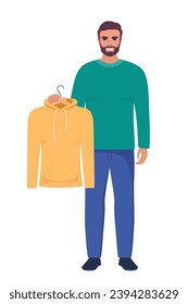 Smiling young man holding hanger with yellow hoody. Choosing clothes concept. Vector illustration in flat style