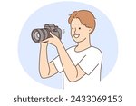 Smiling young man with professional camera taking pictures. Happy guy photographer working with equipment. Photography. Vector illustration.