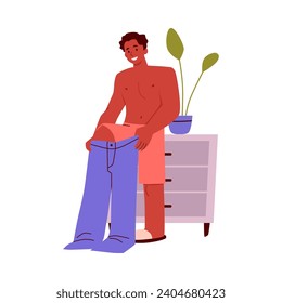 Smiling young man puts on pants flat style, vector illustration isolated on white background. Decorative design element, dressing character, daily routine, beauty and fashion
