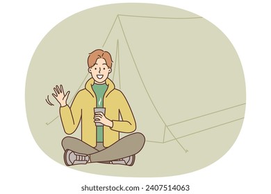 Smiling young man sitting near tent in forest enjoying hiking trip. Happy guy drinking warm coffee or tea on outdoors camping vacation. Vector illustration.