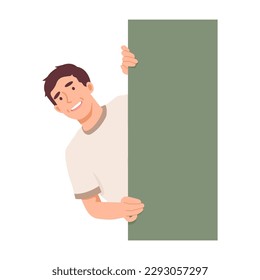 Smiling young man is staring, peeking behind the wall. Cheerful man looks interested and curious. Man pokes his head out of hiding. Flat vector illustration isolated on white background