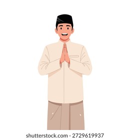 Smiling young muslim man dressed in traditional attire performs the sembah or salam gesture with palms together signifying greeting respect or welcome.
