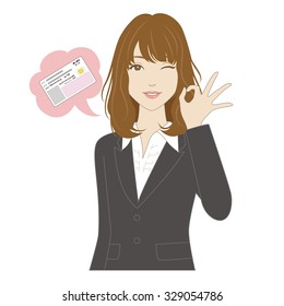 A smiling young woman in business suit signing OK