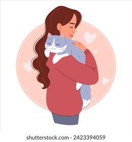 Smiling young woman hugging a cute cat. Happy pet owner