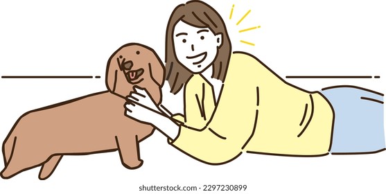 
Smiling young woman lying with her dog