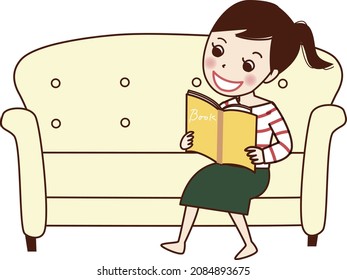 A smiling young woman reading a book on the sofa.
