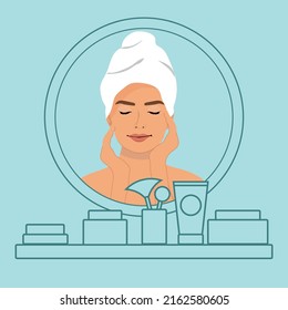 Smiling young woman in towel after shower look in mirror do morning facial care procedures. Happy girl apply face cream for healthy skin. Skincare treatment and beauty.