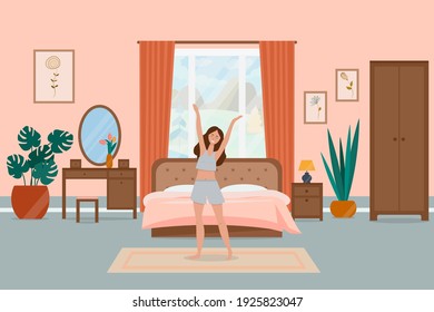 Smiling young woman wakes up in the morning, in the bedroom. The concept of waking up and good morning.