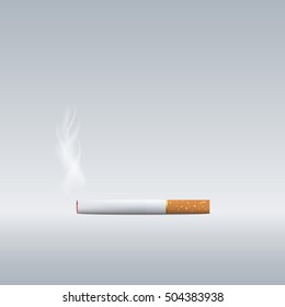 Smoking cigarette isolated on gray background