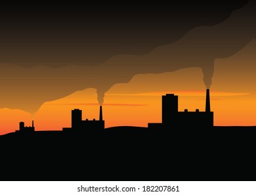 Smoking factory  at sunset