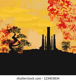  Smoking factory with tree at sunset or sunrise