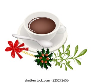 A Smoking Hot Coffee with A Beautiful Mistletoe Bunch or Vi scum Album Decorated with Holly Leaves and Christmas Red Ribbon For Christmas Celebration. 