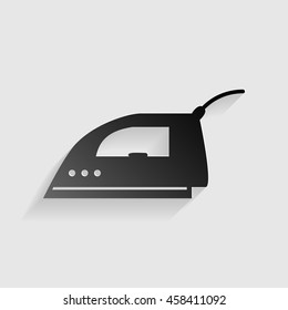Smoothing Iron sign. Black paper with shadow on gray background.