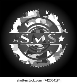 SMS on grey camo texture