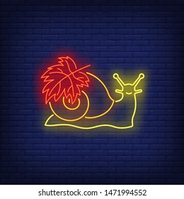 Snail with maple leaf neon sign. Canada, autumn, advertisement design. Night bright neon sign, colorful billboard, light banner. Vector illustration in neon style.