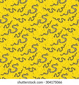 Snake on a yellow background seamless pattern