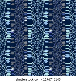 Snake skin scales texture. Seamless pattern baby blue gray white blue on 	
dark navy background. simple ornament, Can be used for fabrics, wallpapers. Vector