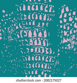 Snake skin seamless pattern. Pink spots on a turquoise background. Rich fashionable texture. Animal trendy pattern.