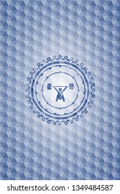 snatch, weightlifting icon inside blue emblem or badge with geometric pattern background.
