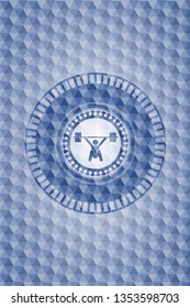 snatch, weightlifting icon inside blue emblem with geometric background.