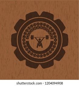 snatch, weightlifting icon inside realistic wooden emblem
