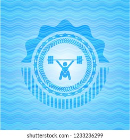 snatch, weightlifting icon inside sky blue water wave style emblem.