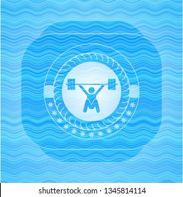 snatch, weightlifting icon inside sky blue water wave style badge.