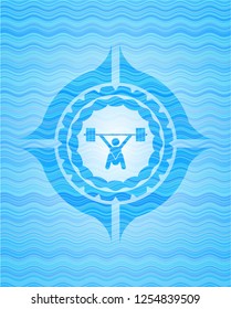 snatch, weightlifting icon inside water representation emblem.