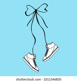  sneakers hang on laces