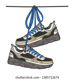 Sneakers are hanging on wire color sketch engraving vector illustration. Scratch board style imitation. Black and white hand drawn image.