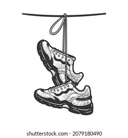 sneakers hanging on a wire sketch engraving vector illustration. T-shirt apparel print design. Scratch board imitation. Black and white hand drawn image.