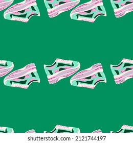 Sneakers seamless pattern. Background of clothing . Repeated texture in doodle style for fabric, wrapping paper, wallpaper, tissue. Vector illustration.