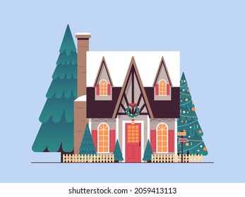 snow covered decorated house winter season home building with decorations for new year and christmas celebration