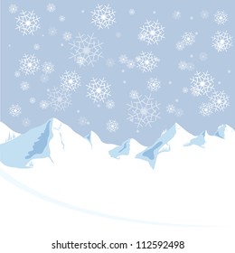 Snow falling down on mountain from winter christmas and new year sky