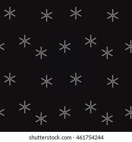 Snow falling snowflakes on a black background.