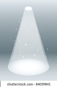 Snow falling in a white spotlight concept