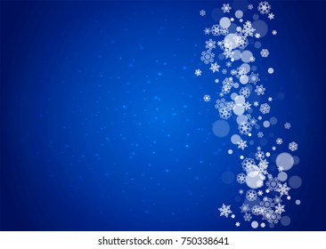 Snow frame with white snowflakes for Christmas and New Year celebration on blue background with sparkles. Horizontal snow frame for banners, gift coupon, voucher, ads, party event. Falling frosty snow