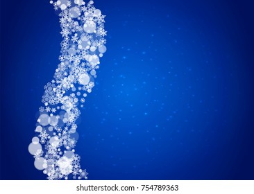 Snow frame with white snowflakes for Christmas and New Year celebration on blue background with sparkles. Horizontal snow frame for banners, gift coupon, voucher, ads, party event. Falling frosty snow