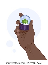 Snow globe in hand. Christmas layer with snow in hand. Holiday mood. Layer with snow and Christmas trees. Winter. Dark-skinned.