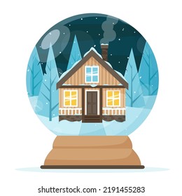 Un globo de nieve con una casa en el fondo de un bosque cubierto de nieve.