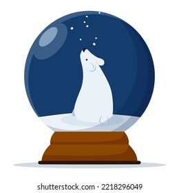 Snow globe with a сute polar bear looking at the falling snowflakes.