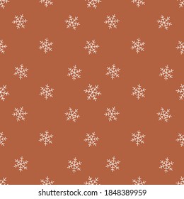 Snow icon brown backround seamless pattern.Great for wrapping paper,srcapbooking,textile,fabric.