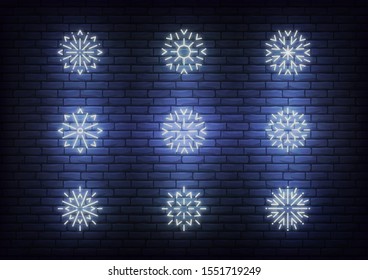 Snow icons neon. Vector glowing neon white snowflake icons