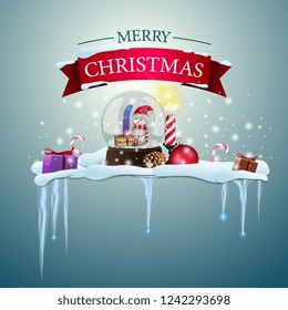 Snow island with icicles, happy Christmas logo and snow globe